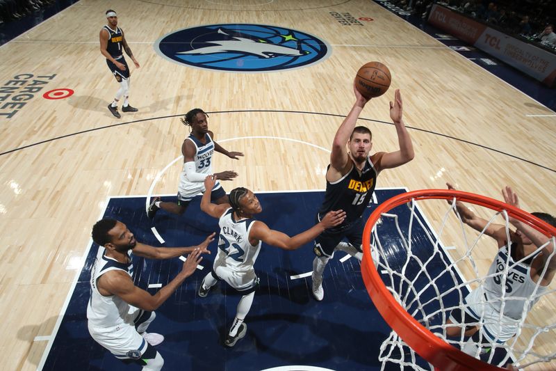 MINNEAPOLIS, MN - OCTOBER 17: Nikola Jokic #15 of the Denver Nuggets shoots the ball during the game against the Minnesota Timberwolves during a NBA Preseason game on October 17, 2024 at Target Center in Minneapolis, Minnesota. NOTE TO USER: User expressly acknowledges and agrees that, by downloading and or using this Photograph, user is consenting to the terms and conditions of the Getty Images License Agreement. Mandatory Copyright Notice: Copyright 2024 NBAE (Photo by Jordan Johnson/NBAE via Getty Images)