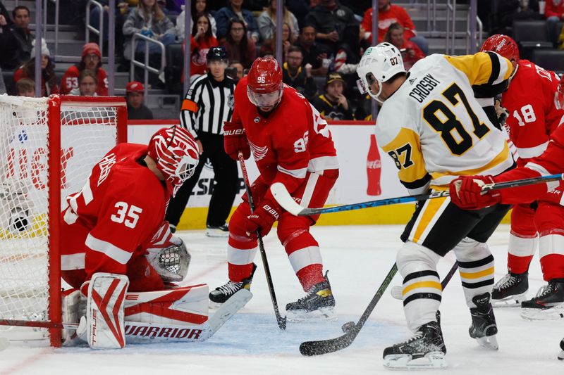 Oct 18, 2023; Detroit, Michigan, USA; Detroit Red Wings goaltender Ville Husso (35) makes a save in front of Pittsburgh Penguins center Sidney Crosby (87) in the third period at Little Caesars Arena. Mandatory Credit: Rick Osentoski-USA TODAY Sports