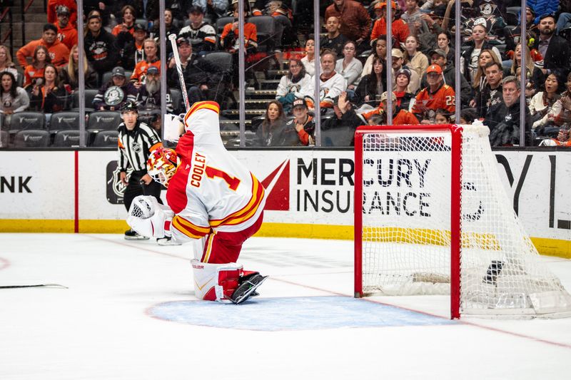 Mar 1, 2026; Anaheim, California, USA; Calgary Flames goaltender Devin Cooley (1) with a save during overtime in the match against the Anaheim Ducks at Honda Center. Mandatory Credit: Corinne Votaw-Imagn Images