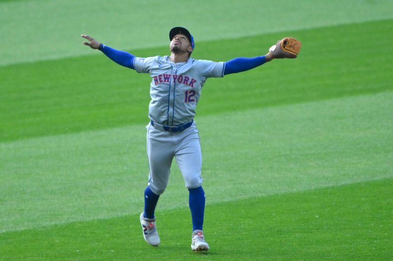 May 21, 2024; Cleveland, Ohio, USA; New York Mets shortstop Francisco Lindor (12) looks for a fly ball in the second inning against the Cleveland Guardians at Progressive Field. Mandatory Credit: David Richard-USA TODAY Sports