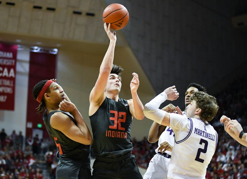 Feb 18, 2024; Bloomington, Indiana, USA;  Indiana Hoosiers guard Trey Galloway (32) attempts a shot over Northwestern Wildcats forward Nick Martinelli (2) during the first half at Simon Skjodt Assembly Hall. Mandatory Credit: Robert Goddin-USA TODAY Sports