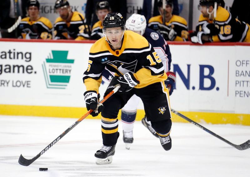 Dec 6, 2022; Pittsburgh, Pennsylvania, USA;  Pittsburgh Penguins right wing Josh Archibald (15) skates up ice with he puck against the Columbus Blue Jackets during the third period at PPG Paints Arena. The Penguins won 4-1. Mandatory Credit: Charles LeClaire-USA TODAY Sports