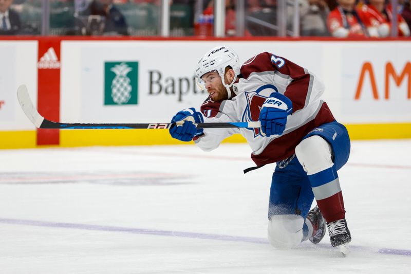 Feb 11, 2023; Sunrise, Florida, USA; Colorado Avalanche left wing J.T. Compher (37) shoots the puck during the first period against the Florida Panthers at FLA Live Arena. Mandatory Credit: Sam Navarro-USA TODAY Sports