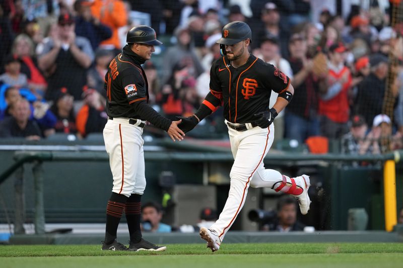 Aug 12, 2023; San Francisco, California, USA; San Francisco Giants designated hitter Michael Conforto (right) is congratulated by third base coach Mark Hallberg (left) after hitting a home run against the Texas Rangers during the fourth inning at Oracle Park. Mandatory Credit: Darren Yamashita-USA TODAY Sports