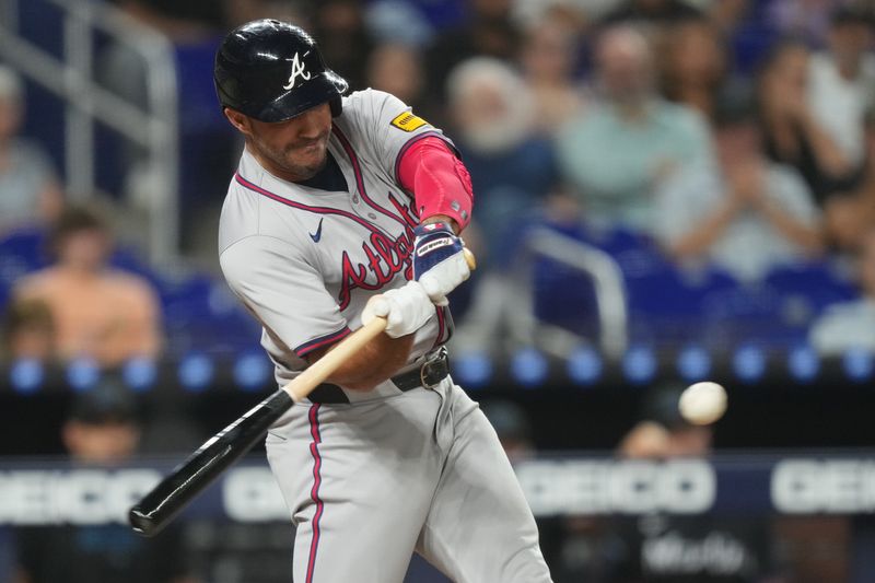 Sep 20, 2024; Miami, Florida, USA;  Atlanta Braves left fielder Ramon Laureano (18) hits a solo home run in the sixth inning against the Miami Marlins at loanDepot Park. Mandatory Credit: Jim Rassol-Imagn Images