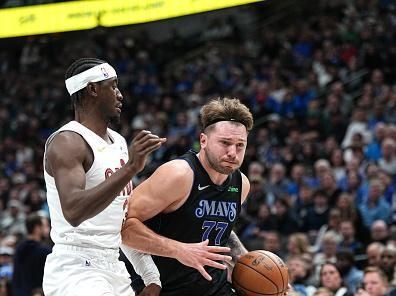 DALLAS, TX - DECEMBER 27: Luka Doncic #77 of the Dallas Mavericks drives to the basket during the game against the Cleveland Cavaliers on December 27, 2023 at the American Airlines Center in Dallas, Texas. NOTE TO USER: User expressly acknowledges and agrees that, by downloading and or using this photograph, User is consenting to the terms and conditions of the Getty Images License Agreement. Mandatory Copyright Notice: Copyright 2023 NBAE (Photo by Glenn James/NBAE via Getty Images)