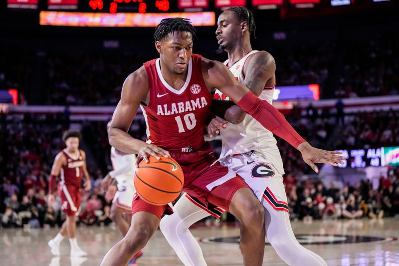 Jan 31, 2024; Athens, Georgia, USA; Alabama Crimson Tide forward Mouhamed Dioubate (10) is defended by Georgia Bulldogs forward Jalen DeLoach (23) during the second half at Stegeman Coliseum. Mandatory Credit: Dale Zanine-USA TODAY Sports