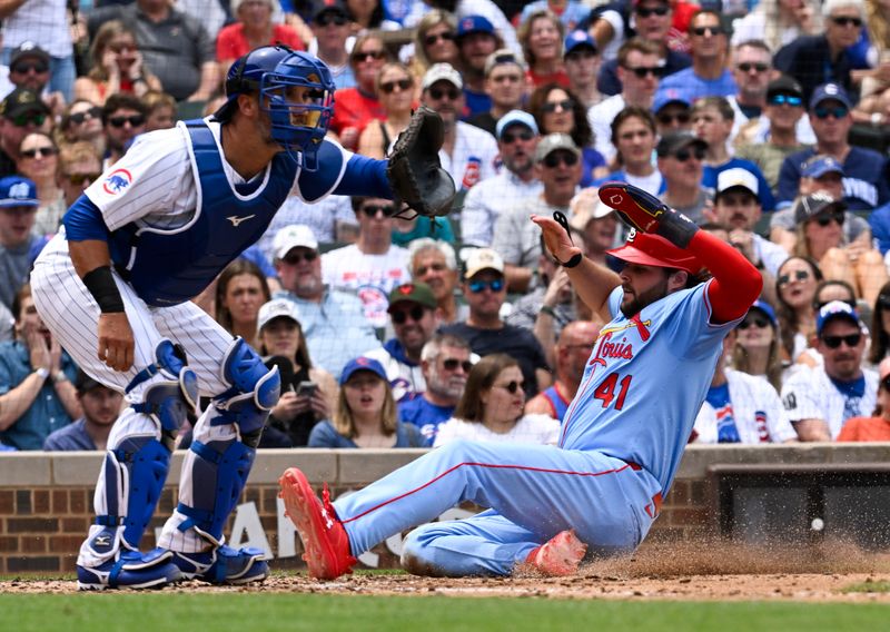 Jun 15, 2024; Chicago, Illinois, USA;  St. Louis Cardinals outfielder Alec Burleson (41) scores past Chicago Cubs catcher Yan Gomes (15) during the fourth inning at Wrigley Field. Mandatory Credit: Matt Marton-USA TODAY Sports