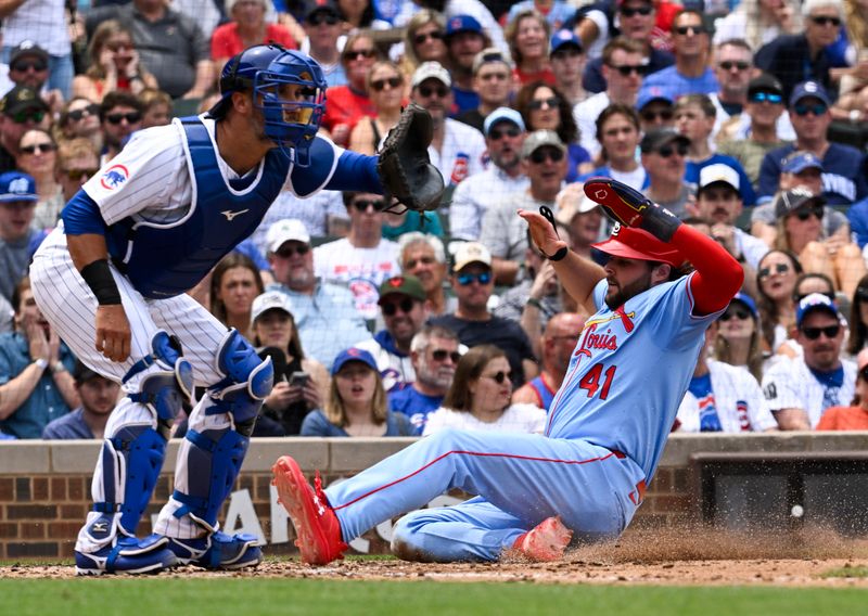 Jun 15, 2024; Chicago, Illinois, USA;  St. Louis Cardinals outfielder Alec Burleson (41) scores past Chicago Cubs catcher Yan Gomes (15) during the fourth inning at Wrigley Field. Mandatory Credit: Matt Marton-USA TODAY Sports