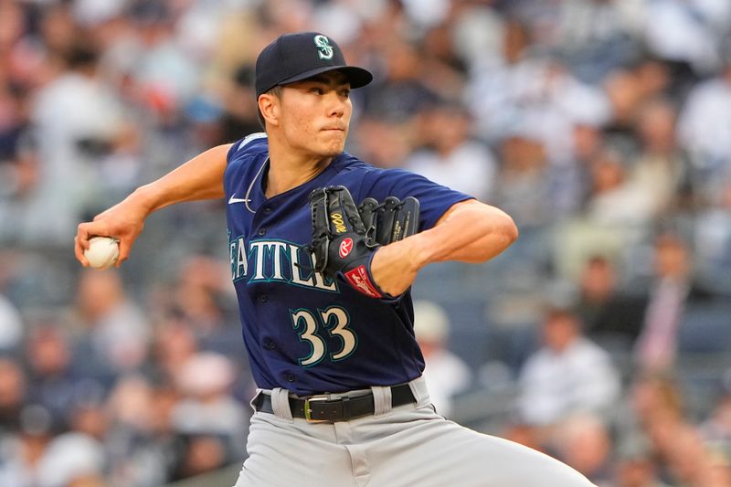 Jun 22, 2023; Bronx, New York, USA; Seattle Mariners pitcher Bryan Woo (33) delivers a pitch against the New York Yankees during the first inning at Yankee Stadium. Mandatory Credit: Gregory Fisher-USA TODAY Sports