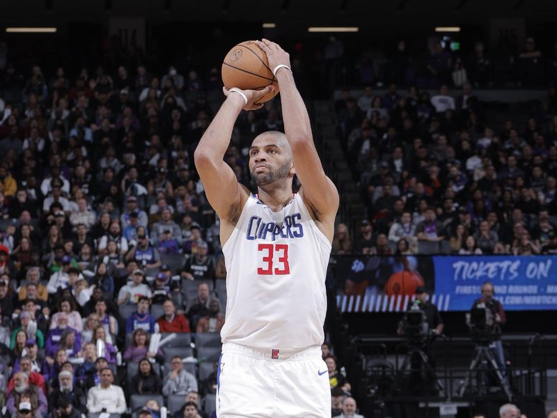 SACRAMENTO, CA - MARCH 3: Nicolas Batum #33 of the LA Clippers shoots a three point basket during the game against the Sacramento Kings on March 3, 2023 at Golden 1 Center in Sacramento, California. NOTE TO USER: User expressly acknowledges and agrees that, by downloading and or using this Photograph, user is consenting to the terms and conditions of the Getty Images License Agreement. Mandatory Copyright Notice: Copyright 2023 NBAE (Photo by Rocky Widner/NBAE via Getty Images)