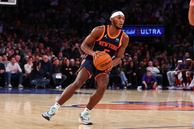 NEW YORK, NY - NOVEMBER 26: Immanuel Quickley #5 of the New York Knicks looks on during the fourth quarter of the game against the Phoenix Suns at Madison Square Garden on November 26, 2023 in New York City, New York. NOTE TO USER: User expressly acknowledges and agrees that, by downloading and or using this photograph, User is consenting to the terms and conditions of the Getty Images License Agreement. (Photo by Rich Graessle/Getty Images)