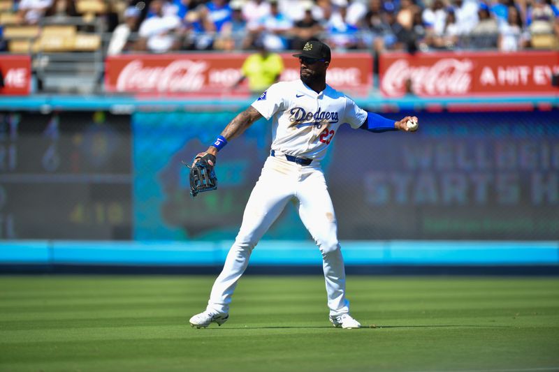 May 19, 2024; Los Angeles, California, USA; Los Angeles Dodgers right fielder Jason Heyward (23) throws after fielding the single of Cincinnati Reds catcher Tyler Stephenson (37) during the ninth inning at Dodger Stadium. Mandatory Credit: Gary A. Vasquez-USA TODAY Sports