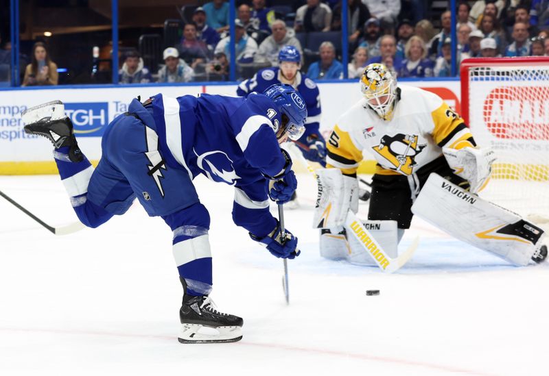 Dec 6, 2023; Tampa, Florida, USA; Tampa Bay Lightning center Alex Barre-Boulet (12) shoots on Pittsburgh Penguins goaltender Alex Nedeljkovic (39) during the first period at Amalie Arena. Mandatory Credit: Kim Klement Neitzel-USA TODAY Sports