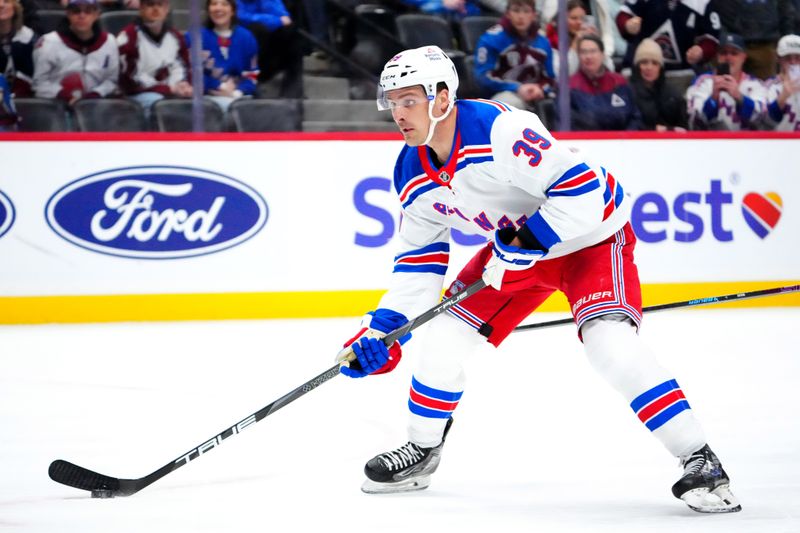 Jan 14, 2025; Denver, Colorado, USA; New York Rangers center Sam Carrick (39) prepares to shoot a short handed goal in the first period against the Colorado Avalanche at Ball Arena. Mandatory Credit: Ron Chenoy-Imagn Images