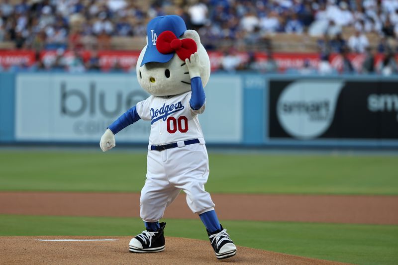 Aug 3, 2023; Los Angeles, California, USA;  Hello Kitty throws the ceremonial first pitch before a game between the Oakland Athletics and the Los Angeles Dodgers at Dodger Stadium. Mandatory Credit: Kiyoshi Mio-USA TODAY Sports