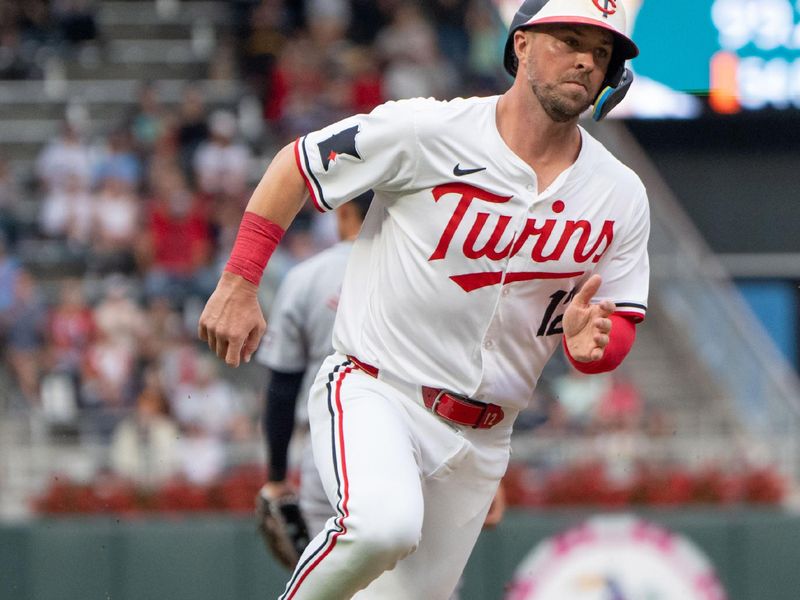 Jul 2, 2024; Minneapolis, Minnesota, USA; Minnesota Twins second base Kyle Farmer (12) rounds third base on his way to score in the third inning against the Detroit Tigers at Target Field. Mandatory Credit: Matt Blewett-USA TODAY Sports