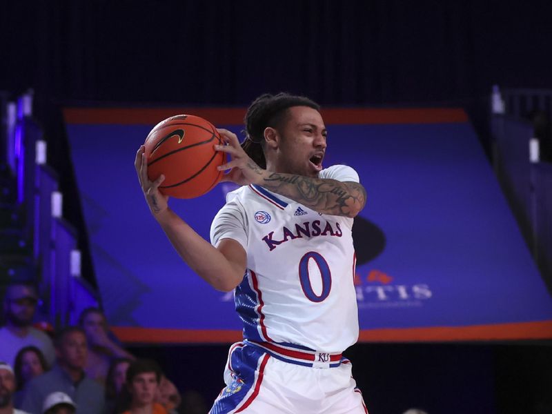 Nov 25, 2022; Paradise Island, BAHAMAS; Kansas Jayhawks guard Bobby Pettiford Jr. (0) tries to save the ball from going out of bounds during the first half against the Tennessee Volunteers at Imperial Arena. Mandatory Credit: Kevin Jairaj-USA TODAY Sports