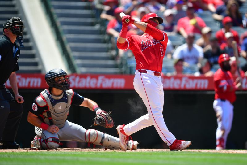 May 26, 2024; Anaheim, California, USA; Los Angeles Angels catcher Matt Thaiss (21) hits a two run home run against the Cleveland Guardians during the fifth inning at Angel Stadium. Mandatory Credit: Gary A. Vasquez-USA TODAY Sports