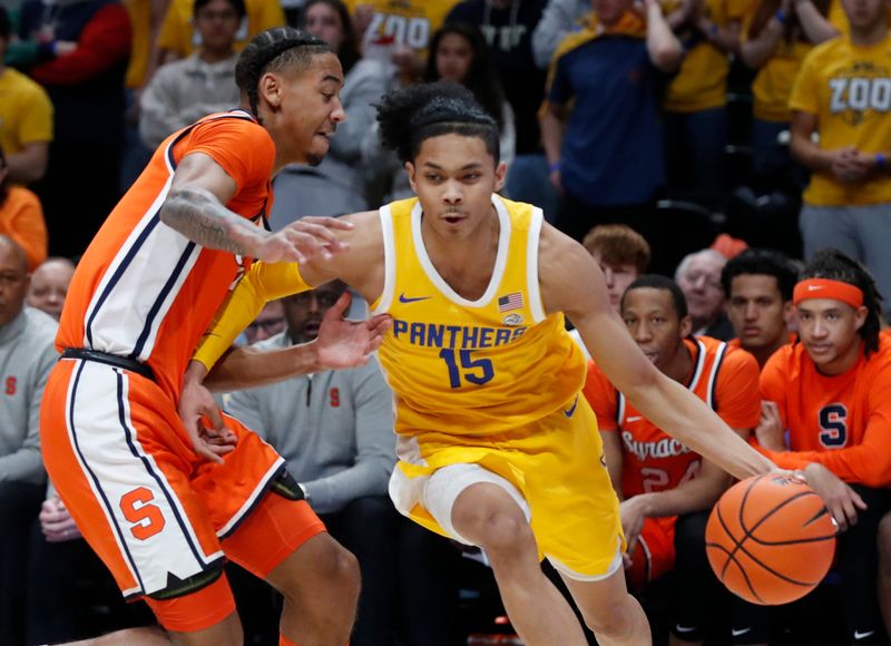 Jan 16, 2024; Pittsburgh, Pennsylvania, USA; Pittsburgh Panthers guard Jaland Lowe (15) goes to the basket as Syracuse Orange guard Judah Mintz (left) defends during the first half at the Petersen Events Center. Mandatory Credit: Charles LeClaire-USA TODAY Sports