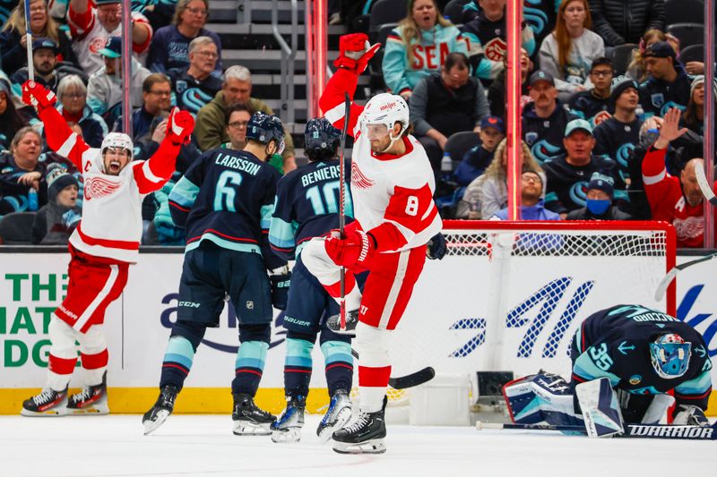 Feb 19, 2024; Seattle, Washington, USA; Detroit Red Wings defenseman Ben Chiarot (8) celebrates after scoring a goal against the Seattle Kraken during overtime at Climate Pledge Arena. Mandatory Credit: Joe Nicholson-USA TODAY Sports