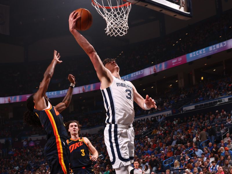 OKLAHOMA CITY, OK - MARCH 10: Jake LaRavia #3 of the Memphis Grizzlies drives to the basket during the game against the Oklahoma City Thunder on March 10, 2024 at Paycom Arena in Oklahoma City, Oklahoma. NOTE TO USER: User expressly acknowledges and agrees that, by downloading and or using this photograph, User is consenting to the terms and conditions of the Getty Images License Agreement. Mandatory Copyright Notice: Copyright 2024 NBAE (Photo by Zach Beeker/NBAE via Getty Images)