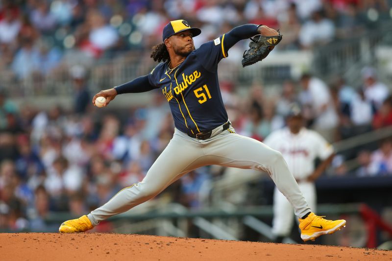 Aug 7, 2024; Atlanta, Georgia, USA; Milwaukee Brewers starting pitcher Freddy Peralta (51) throws against the Atlanta Braves in the second inning at Truist Park. Mandatory Credit: Brett Davis-USA TODAY Sports