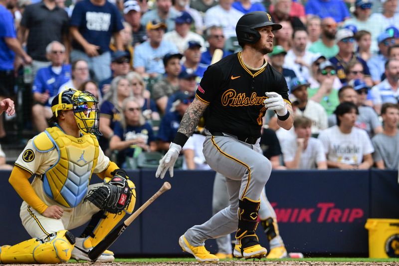 Jul 11, 2024; Milwaukee, Wisconsin, USA; Pittsburgh Pirates catcher Yasmani Grandal (6) hits a double to drive in a run against the Milwaukee Brewers in the seventh inning at American Family Field. Mandatory Credit: Benny Sieu-USA TODAY Sports