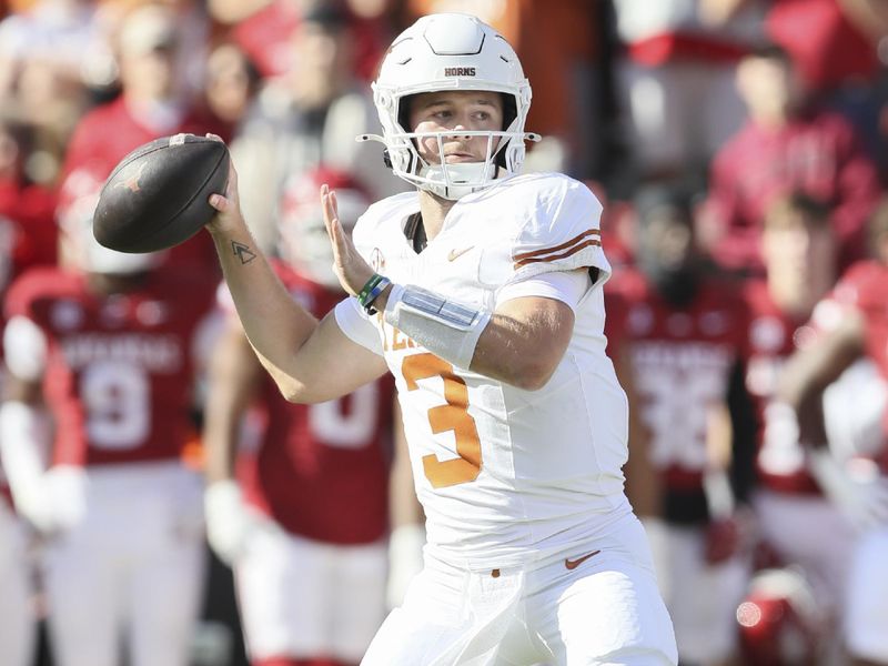 Nov 16, 2024; Fayetteville, Arkansas, USA; Texas Longhorns quarterback Quinn Ewers (3) passes in the first quarter against the Arkansas Razorbacks at Donald W. Reynolds Razorback Stadium. Mandatory Credit: Nelson Chenault-Imagn Images