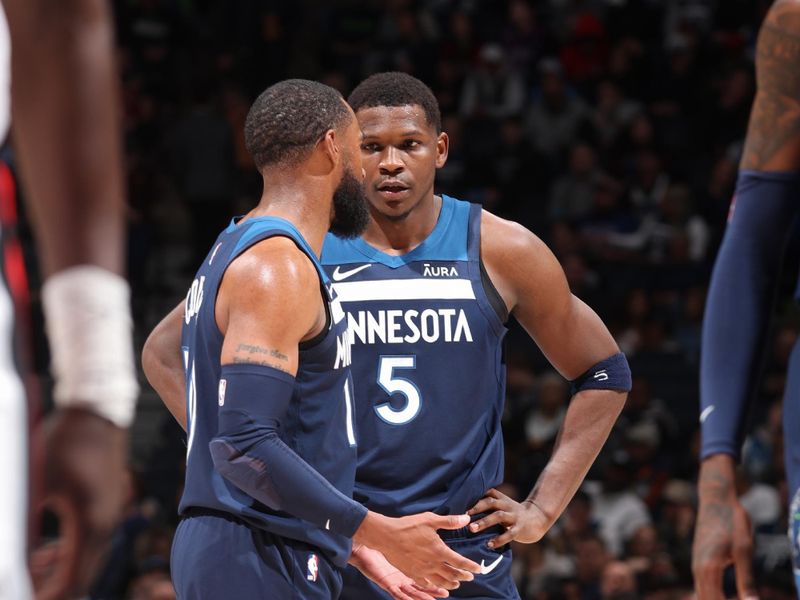 MINNEAPOLIS, MN -  MARCH 4: Mike Conley #10 talks to Anthony Edwards #5 of the Minnesota Timberwolves talk during the game against the Portland Trail Blazers on March 4, 2024 at Target Center in Minneapolis, Minnesota. NOTE TO USER: User expressly acknowledges and agrees that, by downloading and or using this Photograph, user is consenting to the terms and conditions of the Getty Images License Agreement. Mandatory Copyright Notice: Copyright 2024 NBAE (Photo by David Sherman/NBAE via Getty Images)