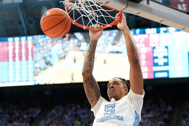 Feb 17, 2024; Chapel Hill, North Carolina, USA; North Carolina Tar Heels forward Armando Bacot (5) scores in the second half at Dean E. Smith Center. Mandatory Credit: Bob Donnan-USA TODAY Sports