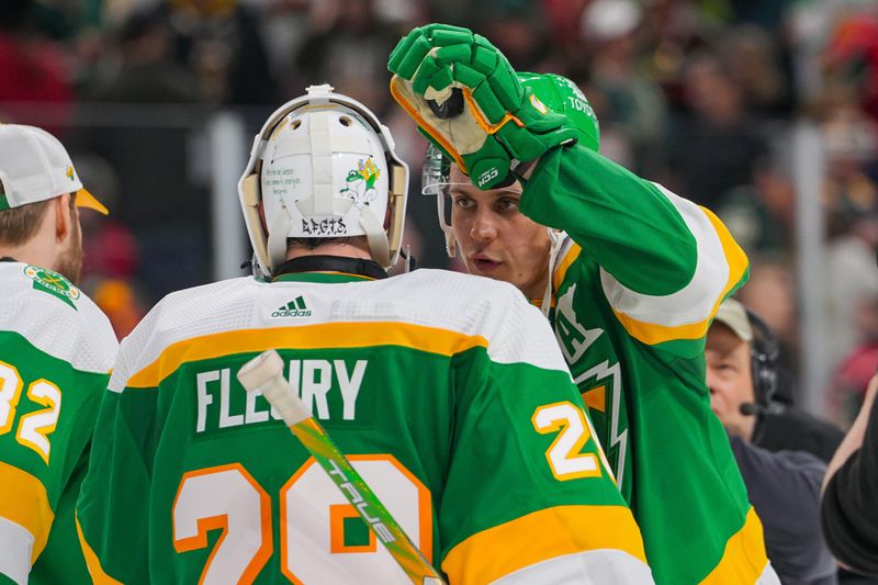 Dec 23, 2023; Saint Paul, Minnesota, USA; Minnesota Wild center Joel Eriksson Ek (14) congratulates goaltender Marc-Andre Fleury (29) after the game against the Boston Bruins at Xcel Energy Center. Mandatory Credit: Brad Rempel-USA TODAY Sports