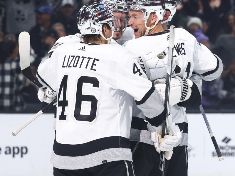 Dec 27, 2023; Los Angeles, California, USA; Los Angeles Kings center Trevor Lewis (61) celebrates with his teammates after scoring a goal during the second period of a game against the San Jose Sharks at Crypto.com Arena. Mandatory Credit: Jessica Alcheh-USA TODAY Sports