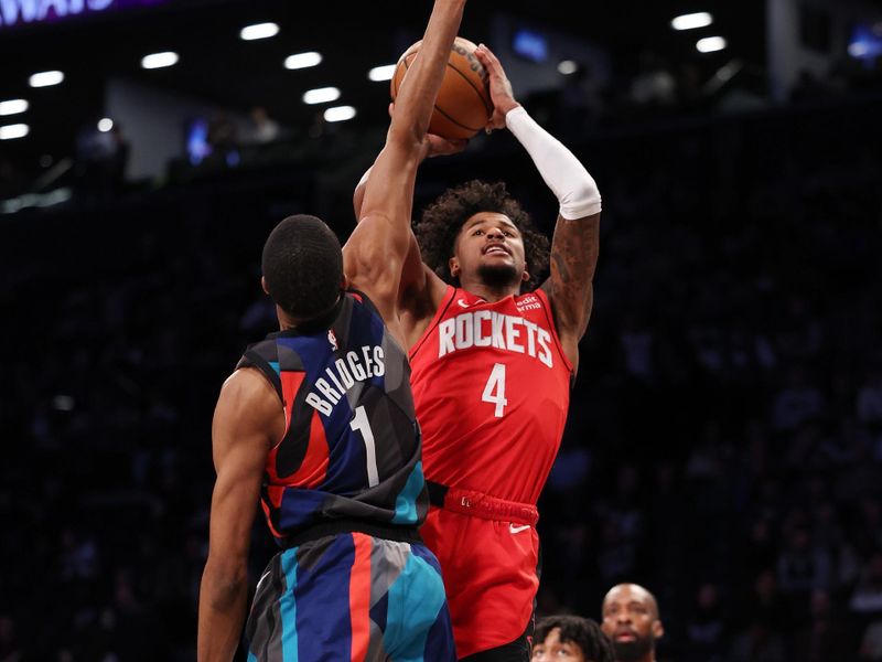 NEW YORK, NEW YORK - JANUARY 27:  Jalen Green #4 of the Houston Rockets shoots against Mikal Bridges #1 of the Brooklyn Nets during their game at Barclays Center on January 27, 2024 in New York City.  User expressly acknowledges and agrees that, by downloading and or using this photograph, User is consenting to the terms and conditions of the Getty Images License Agreement.   (Photo by Al Bello/Getty Images)