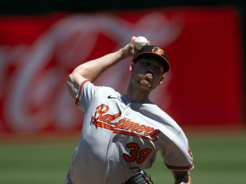 Aug 20, 2023; Oakland, California, USA; Baltimore Orioles starting pitcher Kyle Bradish (39) delivers a pitch against the Oakland Athletics during the second inning at Oakland-Alameda County Coliseum. Mandatory Credit: D. Ross Cameron-USA TODAY Sports