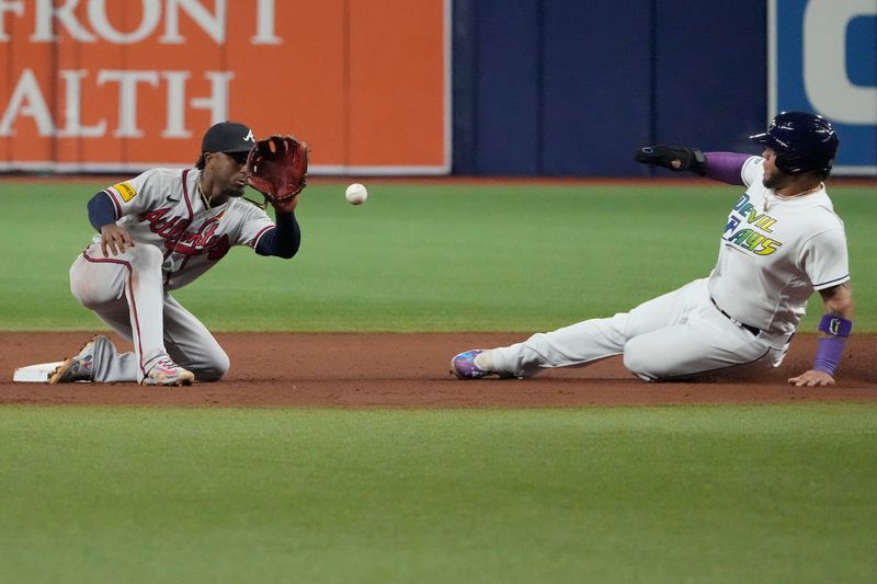 Jul 7, 2023; St. Petersburg, Florida, USA; Tampa Bay Rays designated hitter Harold Ramirez (43) is caught stealing by Atlanta Braves second baseman Ozzie Albies (1) during the seventh inning at Tropicana Field. Mandatory Credit: Dave Nelson-USA TODAY Sports