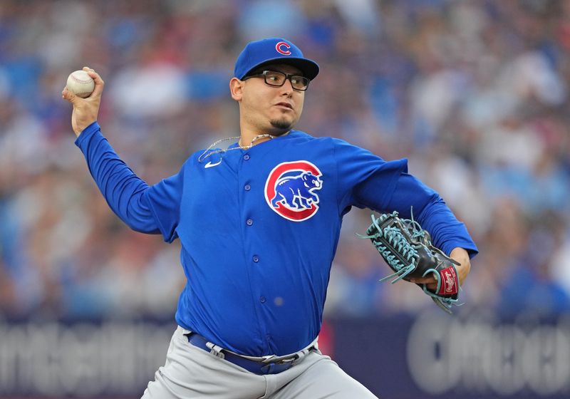 Aug 11, 2023; Toronto, Ontario, CAN; Chicago Cubs starting pitcher Javier Assad (72) throws a pitch against the Toronto Blue Jays during the first inning at Rogers Centre. Mandatory Credit: Nick Turchiaro-USA TODAY Sports