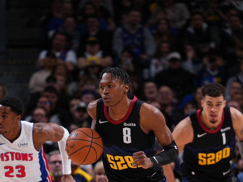 DENVER, CO - JANUARY 7: Peyton Watson #8 of the Denver Nuggets brings the ball up court against the Detroit Pistons on January 7, 2024 at the Ball Arena in Denver, Colorado. NOTE TO USER: User expressly acknowledges and agrees that, by downloading and/or using this Photograph, user is consenting to the terms and conditions of the Getty Images License Agreement. Mandatory Copyright Notice: Copyright 2024 NBAE (Photo by Garrett Ellwood/NBAE via Getty Images)