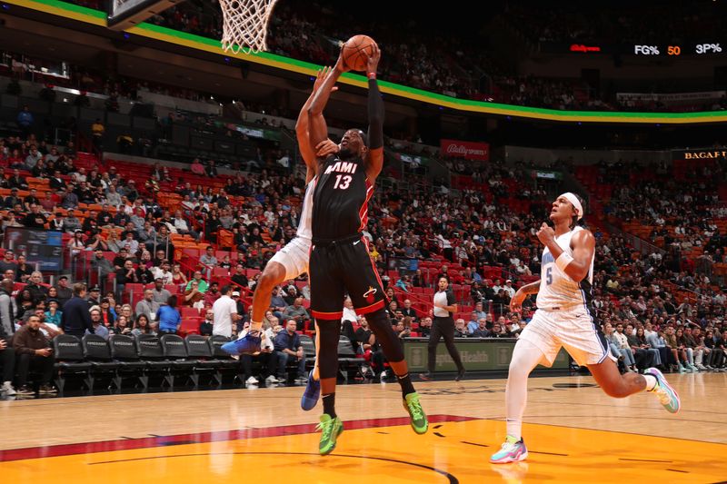 MIAMI, FL - FEBRUARY 6: Bam Adebayo #13 of the Miami Heat dunks the ball during the game against the Orlando Magic on February 6, 2024 at Kaseya Center in Miami, Florida. NOTE TO USER: User expressly acknowledges and agrees that, by downloading and or using this Photograph, user is consenting to the terms and conditions of the Getty Images License Agreement. Mandatory Copyright Notice: Copyright 2024 NBAE (Photo by Issac Baldizon/NBAE via Getty Images)