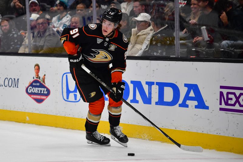 Jan 31, 2024; Anaheim, California, USA; Anaheim Ducks center Leo Carlsson (91) moves the puck against the San Jose Sharks during the second period at Honda Center. Mandatory Credit: Gary A. Vasquez-USA TODAY Sports