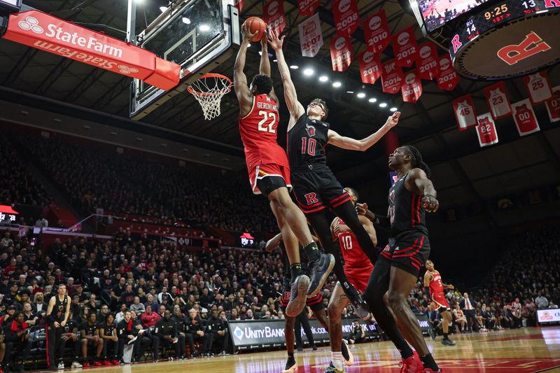 Feb 25, 2024; Piscataway, New Jersey, USA; Maryland Terrapins forward Jordan Geronimo (22) drives for a shot against Rutgers Scarlet Knights guard Gavin Griffiths (10) and center Clifford Omoruyi (11) during the first half at Jersey Mike's Arena. Mandatory Credit: Vincent Carchietta-USA TODAY Sports