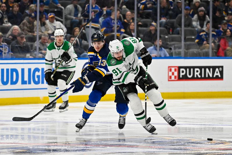 Dec 27, 2023; St. Louis, Missouri, USA;  Dallas Stars center Tyler Seguin (91) controls the puck against the St. Louis Blues during the third period at Enterprise Center. Mandatory Credit: Jeff Curry-USA TODAY Sports