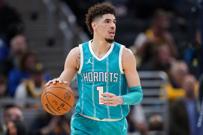 INDIANAPOLIS, INDIANA - OCTOBER 17: LaMelo Ball #1 of the Charlotte Hornets dribbles the ball in the first quarter against the Indiana Pacers during a preseason game at Gainbridge Fieldhouse on October 17, 2024 in Indianapolis, Indiana. NOTE TO USER: User expressly acknowledges and agrees that, by downloading and or using this photograph, User is consenting to the terms and conditions of the Getty Images License Agreement. (Photo by Dylan Buell/Getty Images)