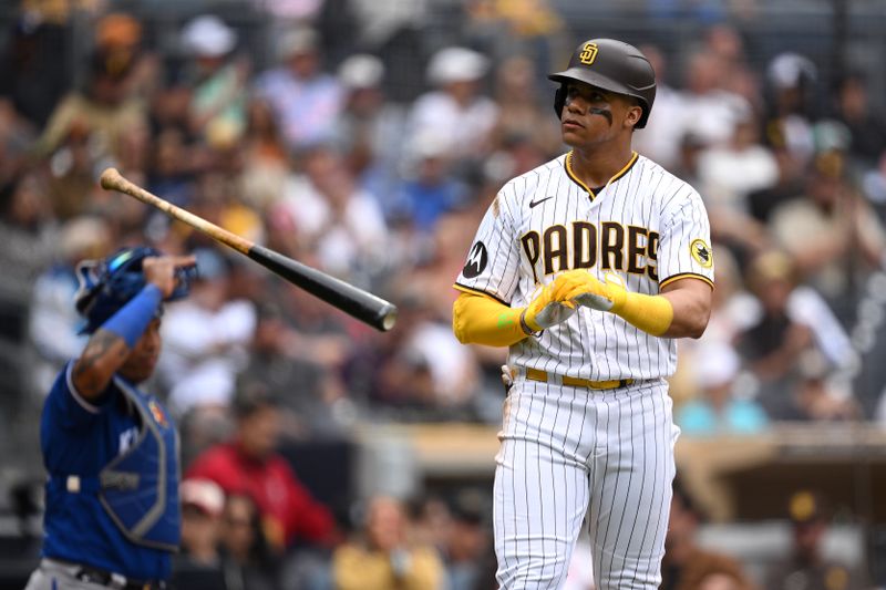 May 17, 2023; San Diego, California, USA; San Diego Padres left fielder Juan Soto (22) tosses his bat after a walk during the seventh inning against the Kansas City Royals at Petco Park. Mandatory Credit: Orlando Ramirez-USA TODAY Sports