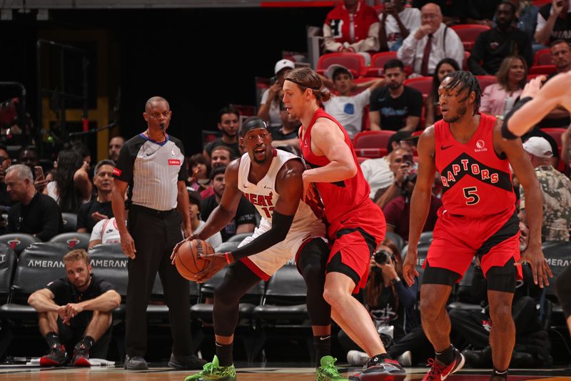 MIAMI, FL - APRIL 12: Bam Adebayo #13 of the Miami Heat handles the ball during the game against the Toronto Raptors  on April 12, 2024 at Kaseya Center in Miami, Florida. NOTE TO USER: User expressly acknowledges and agrees that, by downloading and or using this Photograph, user is consenting to the terms and conditions of the Getty Images License Agreement. Mandatory Copyright Notice: Copyright 2024 NBAE (Photo by Issac Baldizon/NBAE via Getty Images)