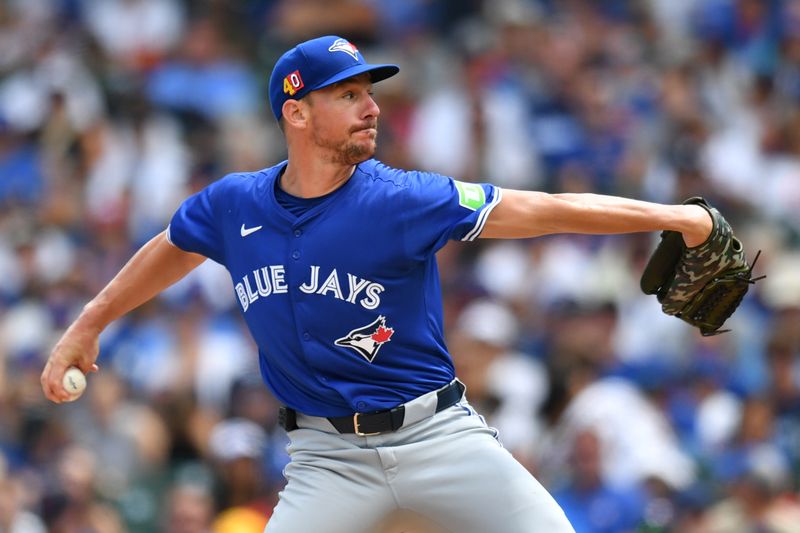 Aug 17, 2024; Chicago, Illinois, USA; Toronto Blue Jays starting pitcher Chris Bassitt (40) pitches during the first inning against the Chicago Cubs at Wrigley Field. Mandatory Credit: Patrick Gorski-USA TODAY Sports