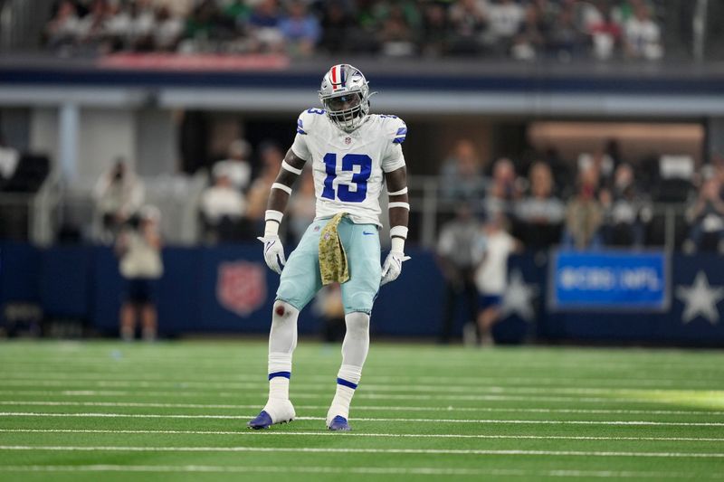 Dallas Cowboys linebacker DeMarvion Overshown (13) celebrates after sacking Philadelphia Eagles' Jalen Hurts in the first half of an NFL football game in Arlington, Texas, Sunday, Nov. 10, 2024. (AP Photo/Jeffrey McWhorter)