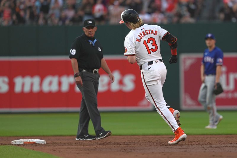 Jun 27, 2024; Baltimore, Maryland, USA; Baltimore Orioles outfielder Heston Kjerstad (13) rounds the bases following his two-run home run in the third inning against the Texas Rangers at Oriole Park at Camden Yards. Mandatory Credit: Mitch Stringer-USA TODAY Sports