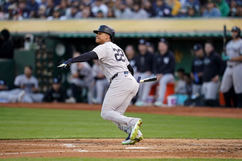 Sep 21, 2024; Oakland, California, USA; New York Yankees right fielder Juan Soto (22) hits a single against the Oakland Athletics in the third inning at the Oakland-Alameda County Coliseum. Mandatory Credit: Cary Edmondson-Imagn Images