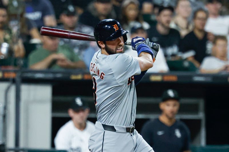 Aug 23, 2024; Chicago, Illinois, USA; Detroit Tigers outfielder Matt Vierling (8) hits an RBI-single against the Chicago White Sox during the seventh inning at Guaranteed Rate Field. Mandatory Credit: Kamil Krzaczynski-USA TODAY Sports